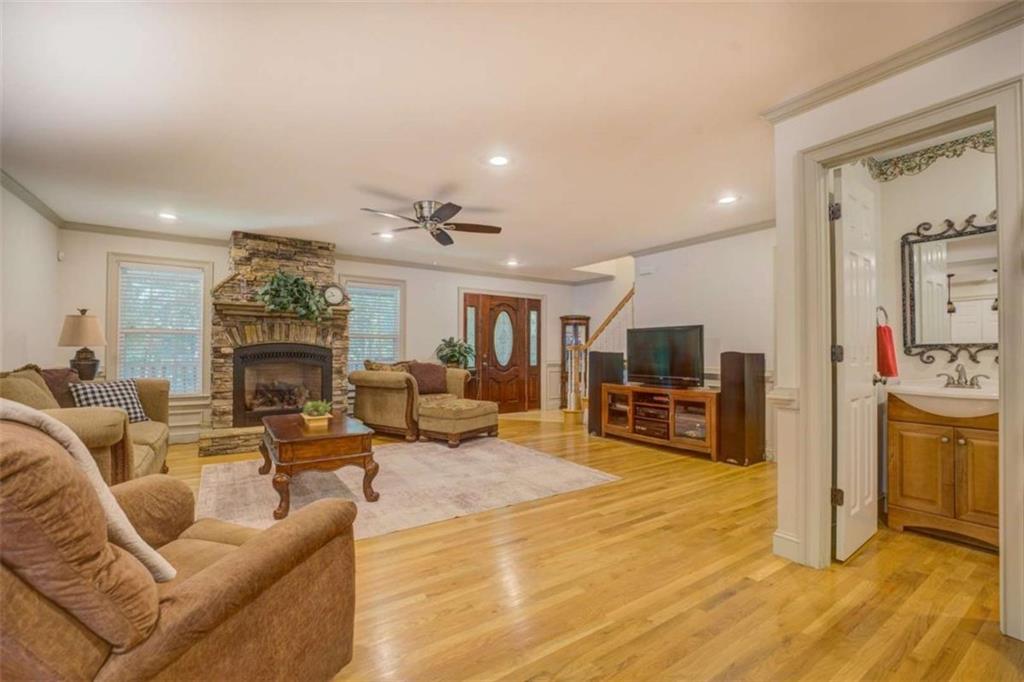 455 Bethany Road Covington, GA 30016 - Photo 8 of 39 a living room with furniture and a fireplace