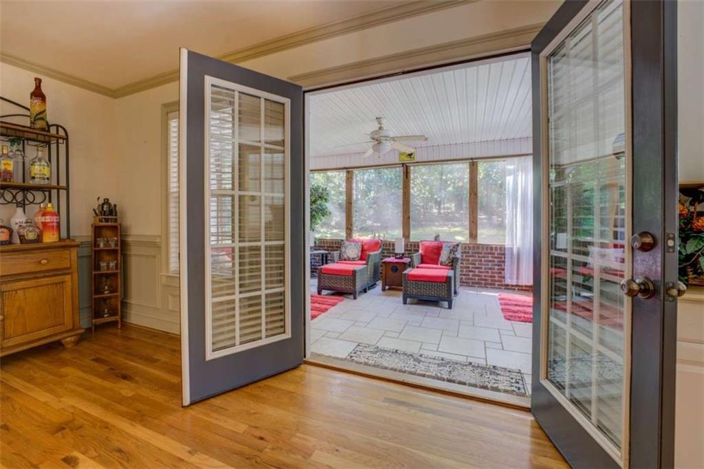 455 Bethany Road Covington, GA 30016 - Photo 10 of 39 a living room filled with furniture and a floor to ceiling window