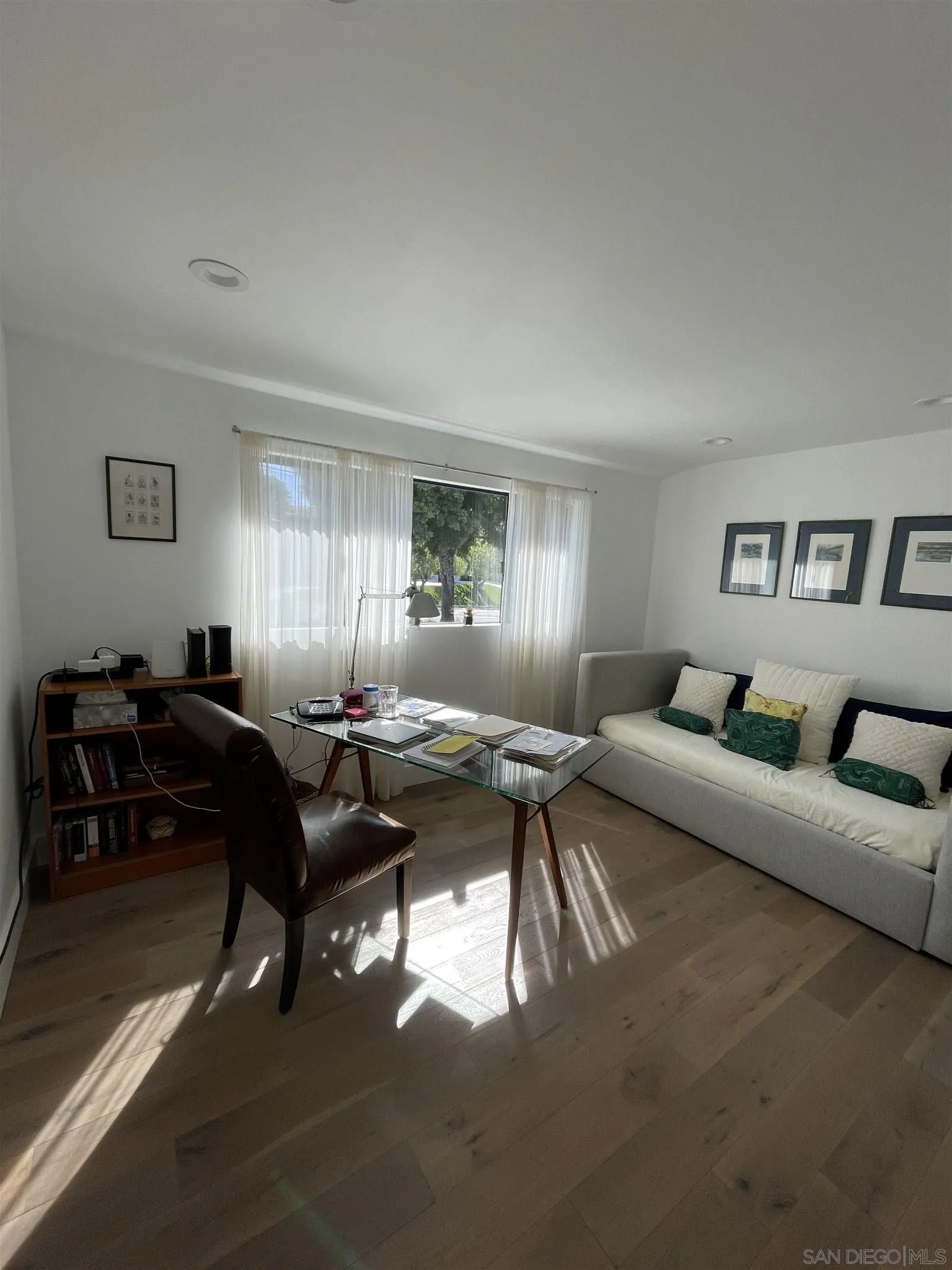 1402 Rodeo Drive La Jolla, CA 92037 - Photo 17 of 62 a living room with furniture a rug and a window