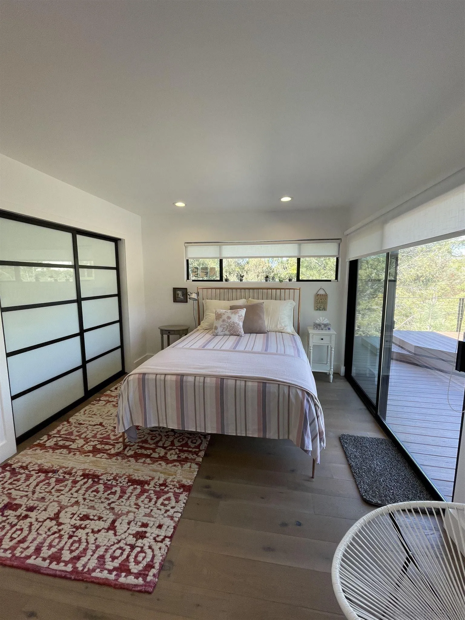 1402 Rodeo Drive La Jolla, CA 92037 - Photo 19 of 62 a bedroom with a bed and wooden floor