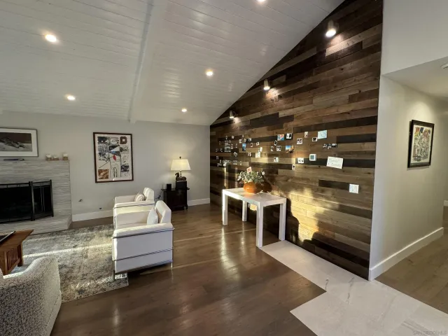 a view of a living room and kitchen with furniture