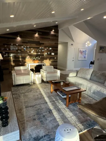 a kitchen with stainless steel appliances granite countertop a sink a stove and a granite counter top