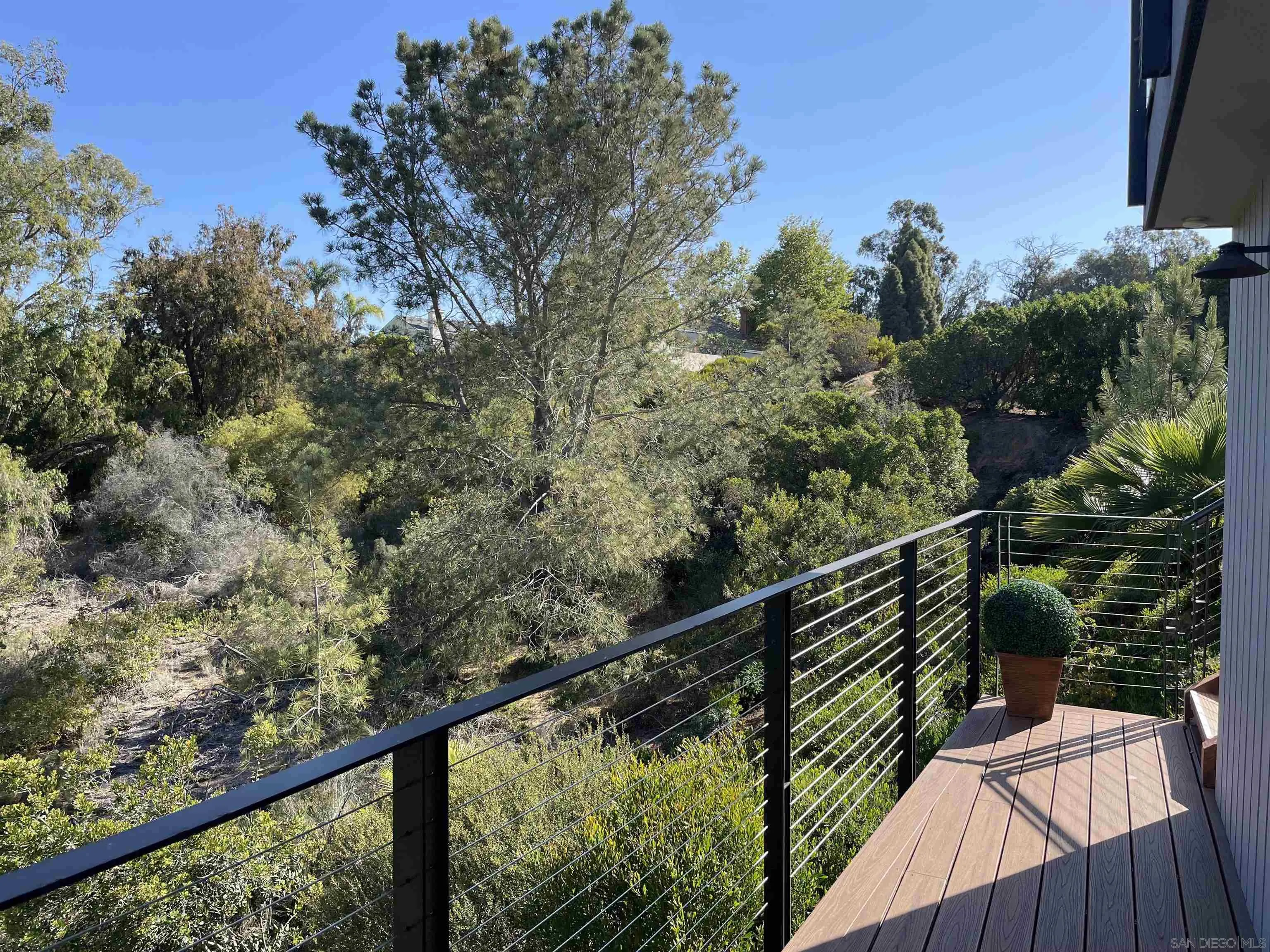 1402 Rodeo Drive La Jolla, CA 92037 - Photo 42 of 62 a view of a balcony with wooden floor and fence