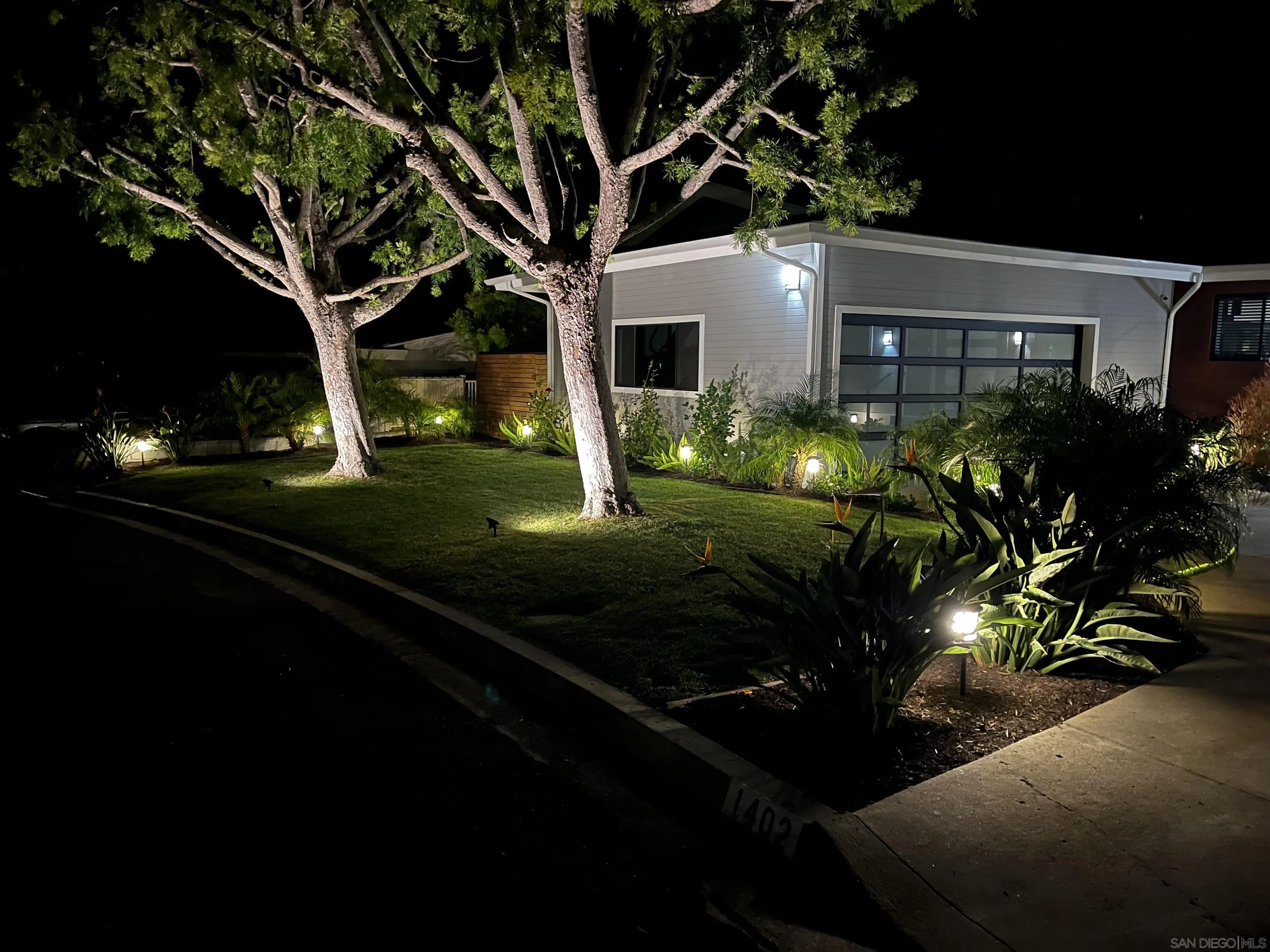 1402 Rodeo Drive La Jolla, CA 92037 - Photo 58 of 62 a front view of a house with yard