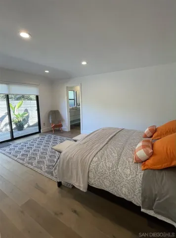 a bathroom with a granite countertop sink and mirror