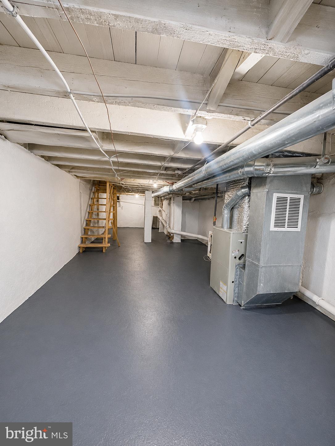 2655 Cedar Street Philadelphia, PA 19125 - Photo 18 of 22 a view of water heater room with stairs