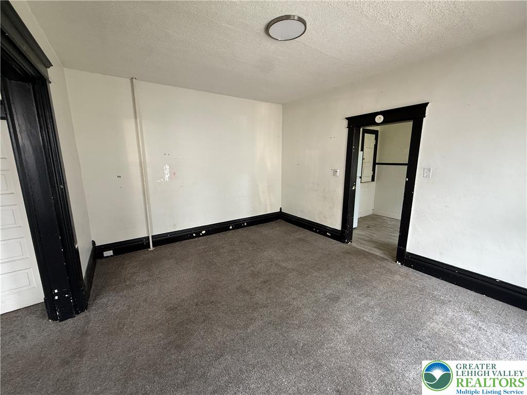 41 West Ridge Street Lansford, PA 18232 - Photo 10 of 40 A well-proportioned room awaits personalization, offering ample space for comfortable living.
