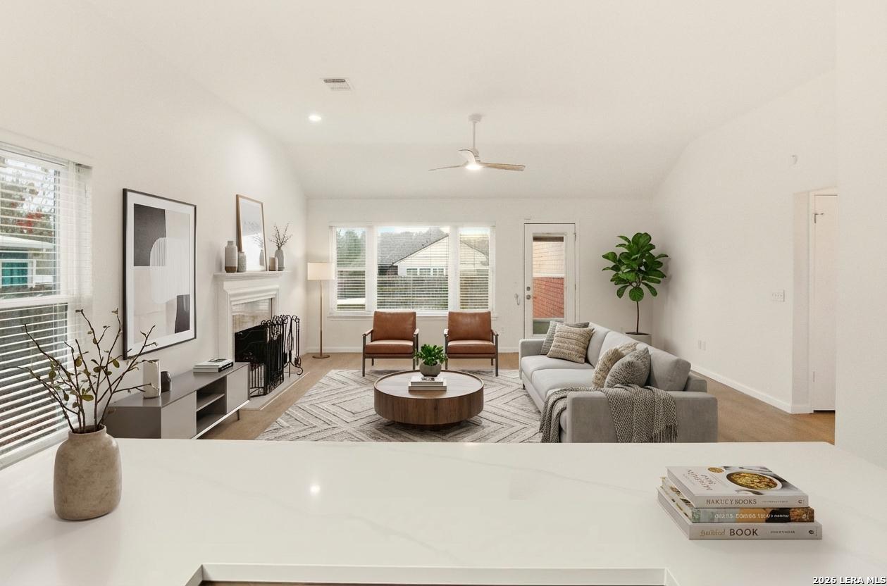 a living room with furniture and a large window