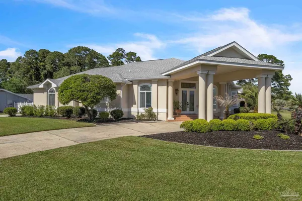 a view of a swimming pool with a patio