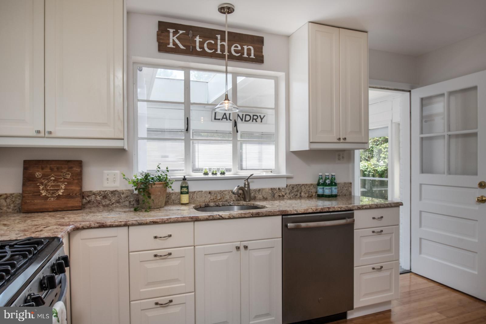 2101 Shenandoah Road Alexandria, VA 22308 - Photo 14 of 44 a kitchen with granite countertop white cabinets and white stainless steel appliances