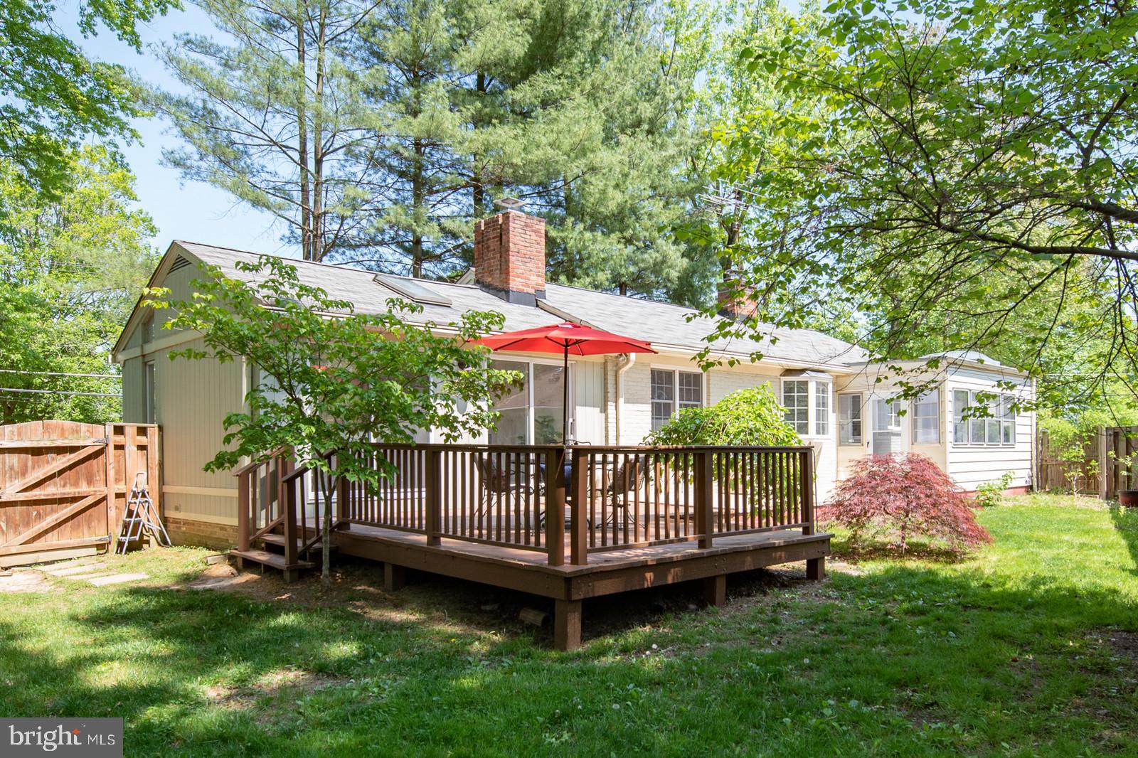 2101 Shenandoah Road Alexandria, VA 22308 - Photo 26 of 44 a view of a house with a yard and deck