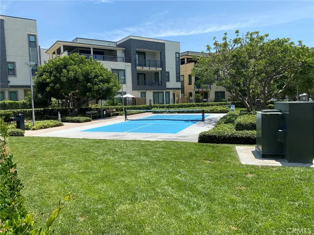 a view of a house with a backyard and a patio