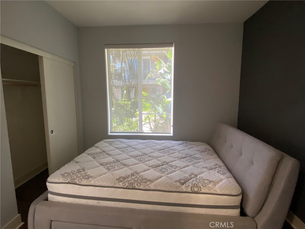270 Rockefeller Irvine, CA 92612 - Photo 6 of 12 a bedroom with a bed and window