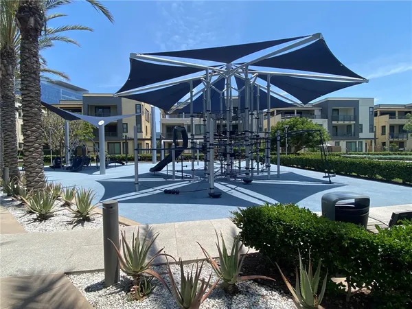 a view of a patio with table and chairs under an umbrella