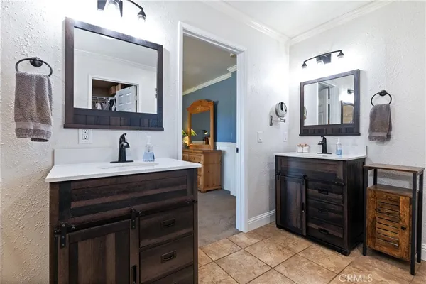 a bathroom with a sink vanity and mirror