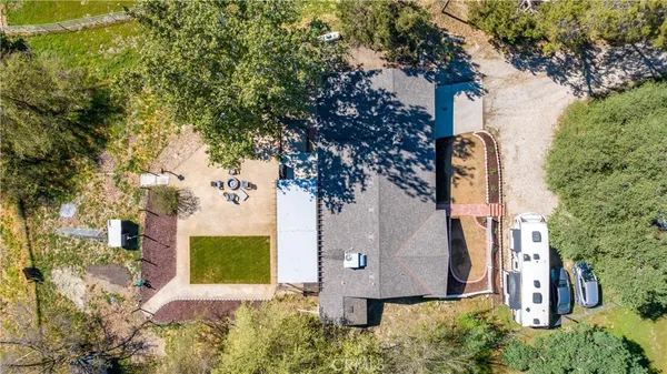 a view of a house with a yard and tree s