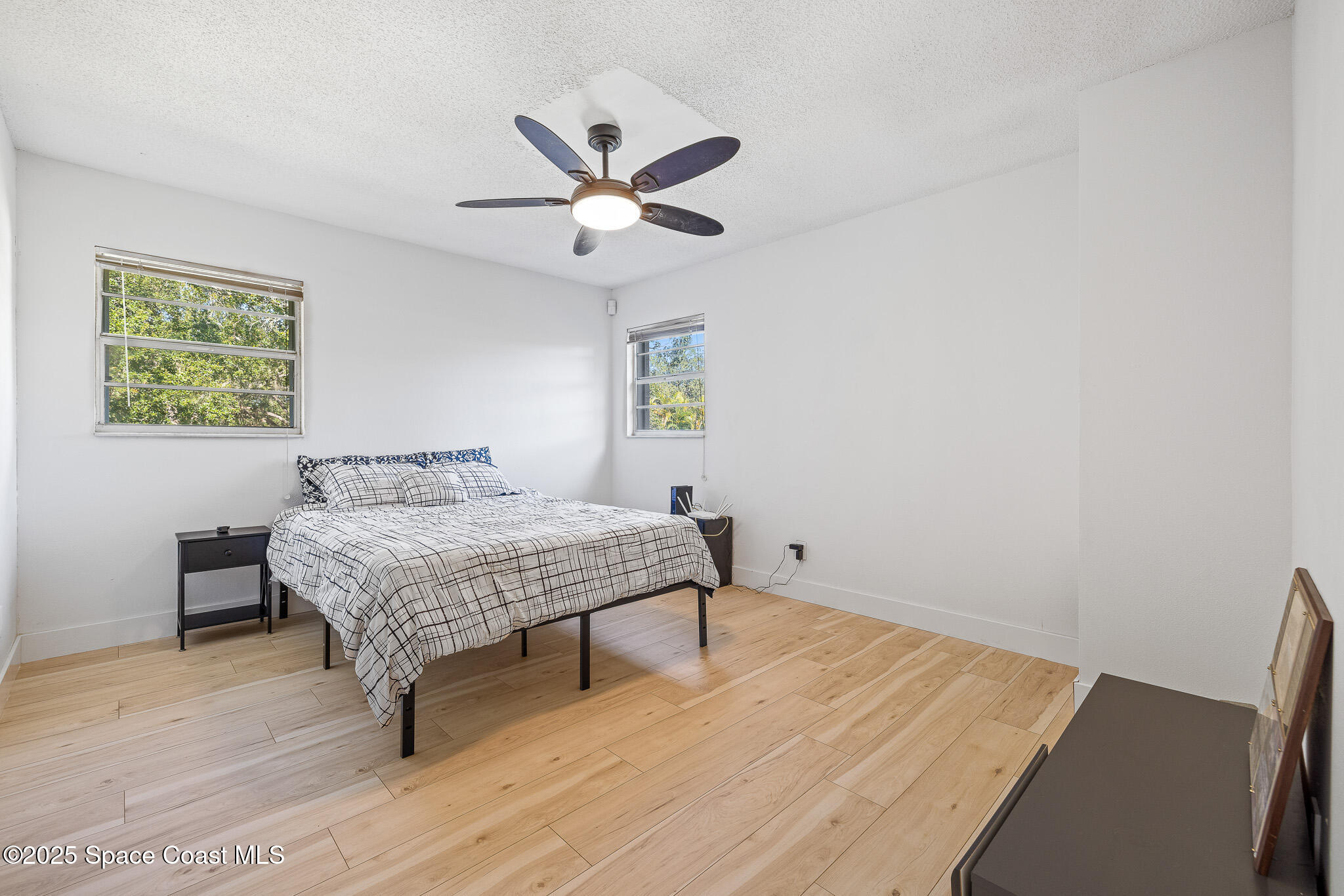 1274 Cimarron Circle Northeast Palm Bay, FL 32905 - Photo 19 of 37 a bedroom with a bed and a window