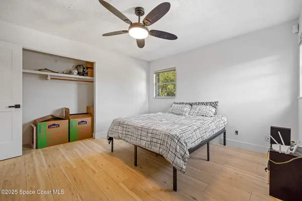 a bedroom that has a bed and a table in it