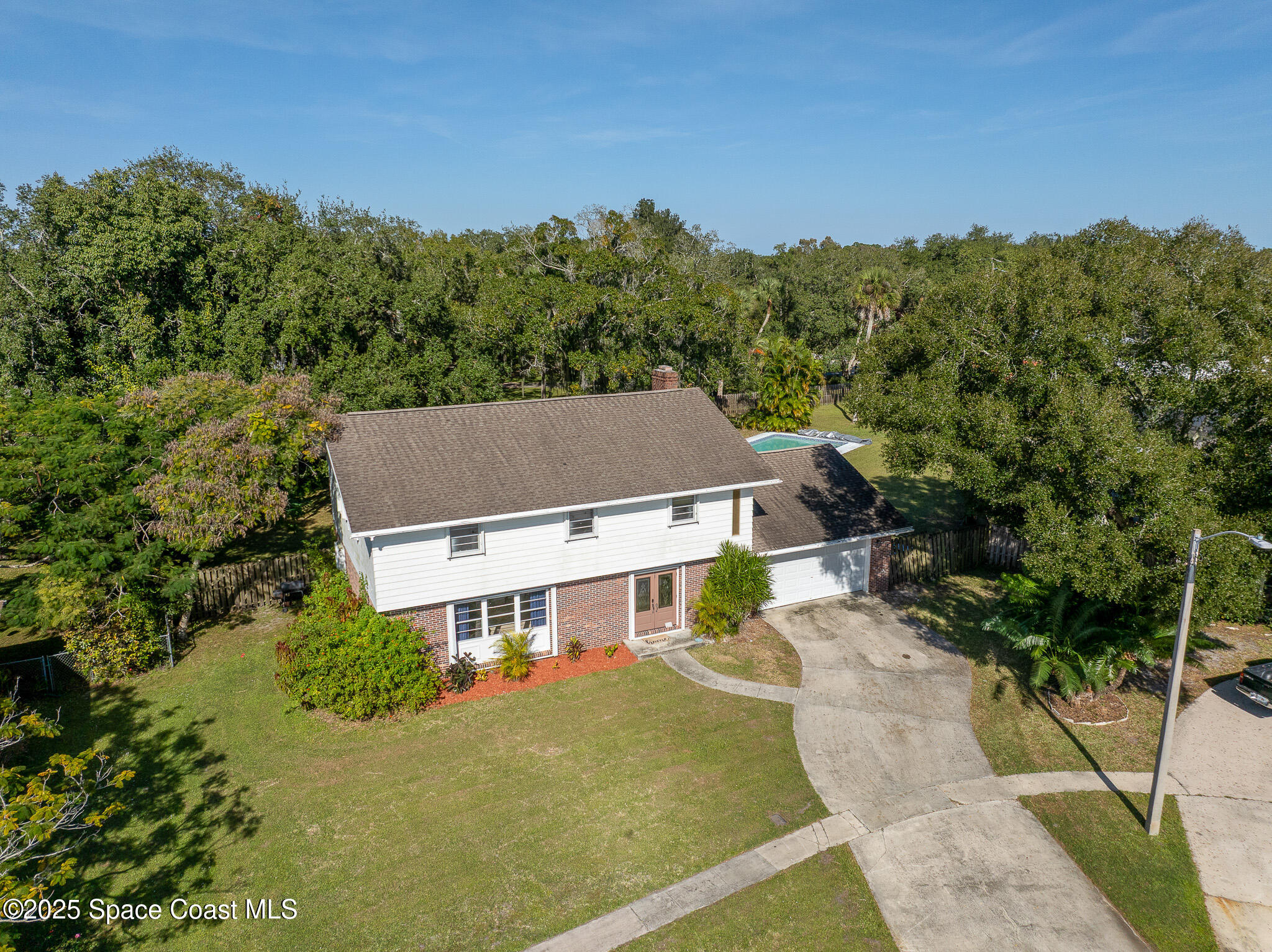 1274 Cimarron Circle Northeast Palm Bay, FL 32905 - Photo 26 of 37 an aerial view of a house