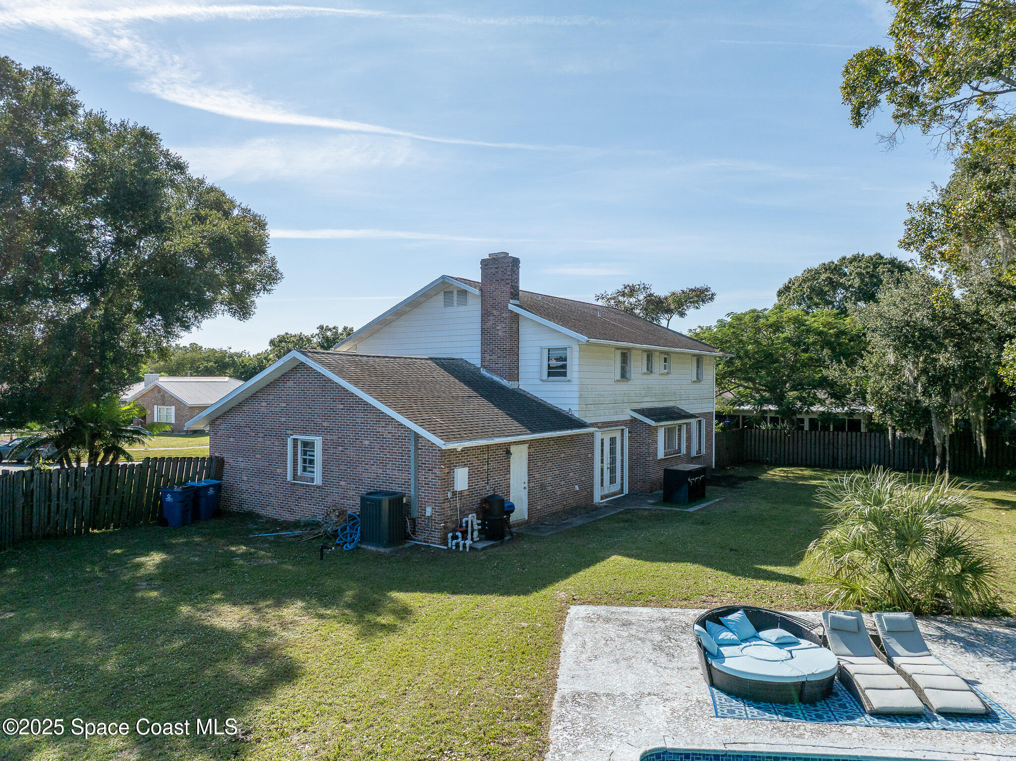 1274 Cimarron Circle Northeast Palm Bay, FL 32905 - Photo 27 of 37 a view of a house with a garden