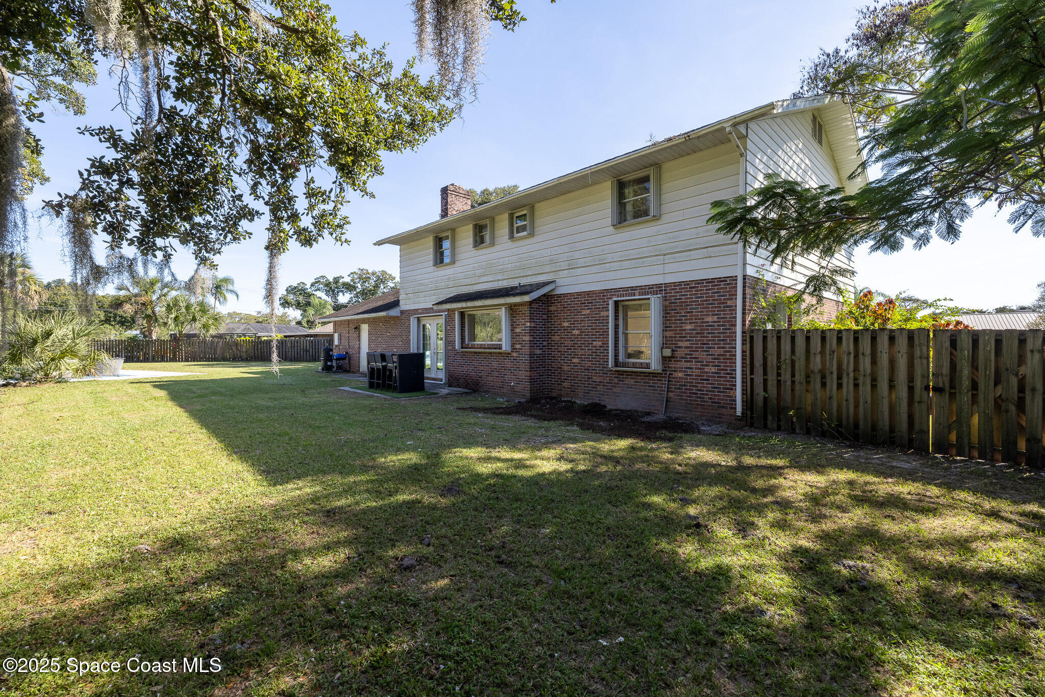 1274 Cimarron Circle Northeast Palm Bay, FL 32905 - Photo 28 of 37 a view of a house with a yard