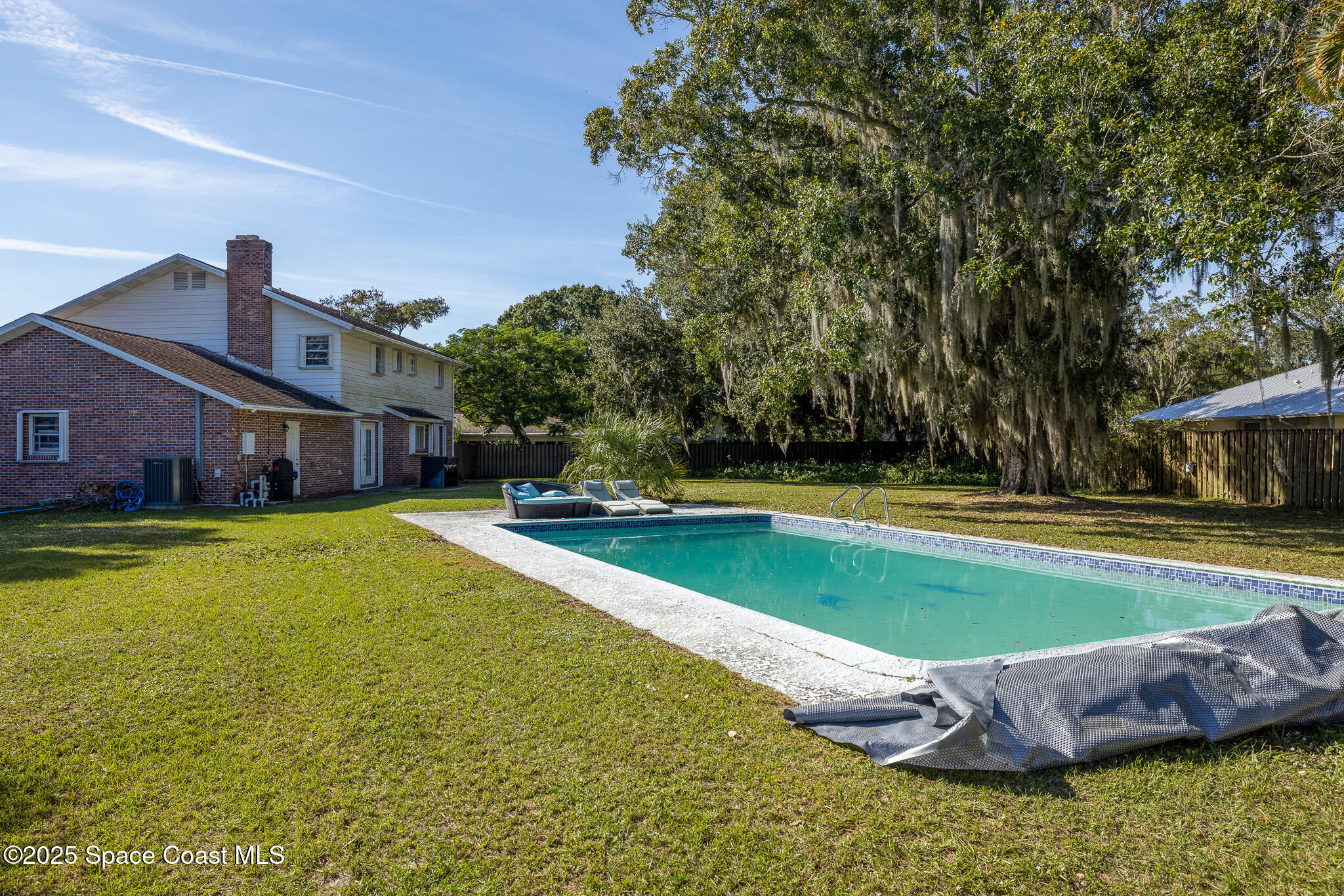 1274 Cimarron Circle Northeast Palm Bay, FL 32905 - Photo 30 of 37 a view of outdoor space yard swimming pool and patio