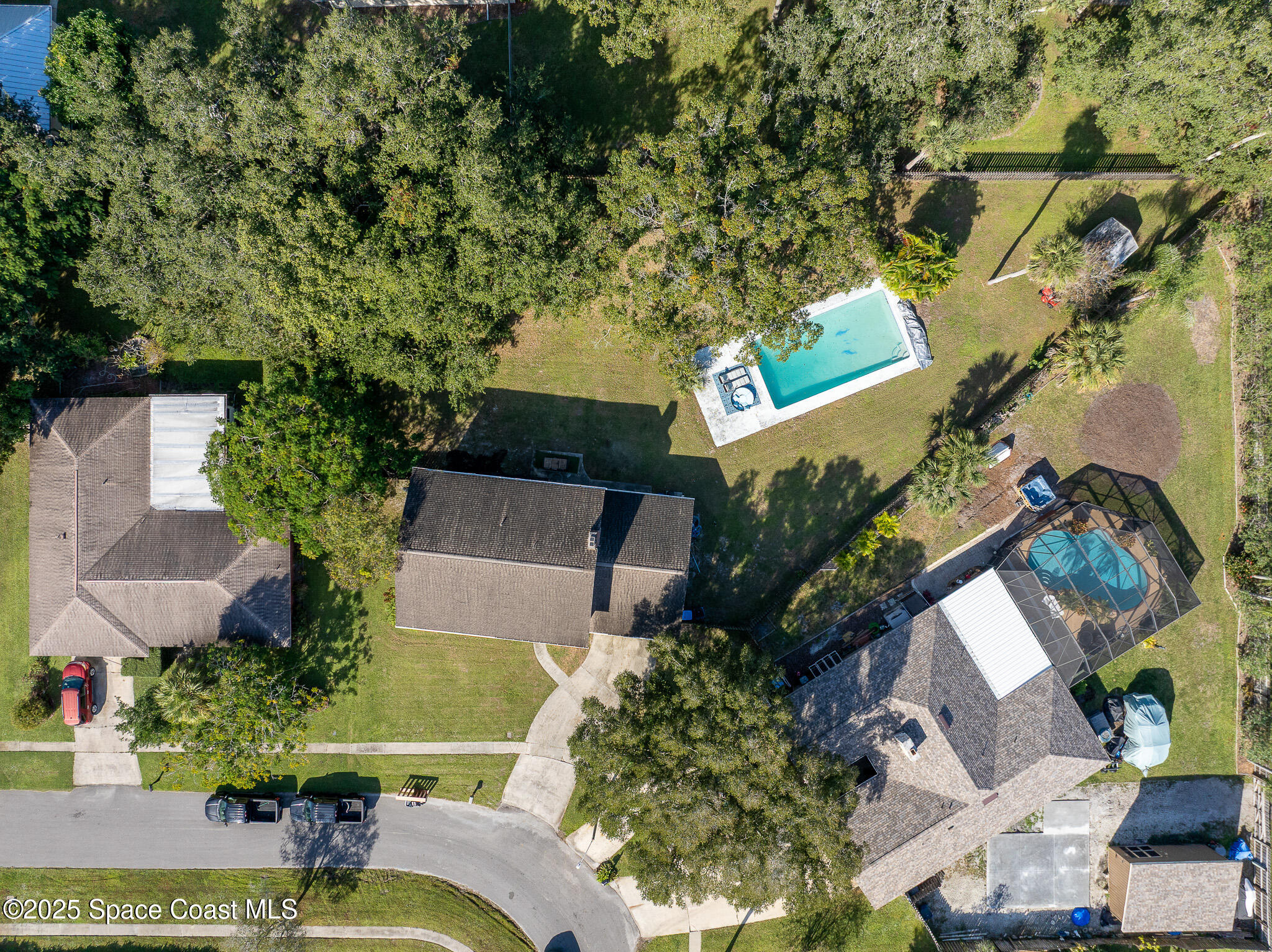 1274 Cimarron Circle Northeast Palm Bay, FL 32905 - Photo 37 of 37 an aerial view of a house with yard swimming pool and outdoor seating