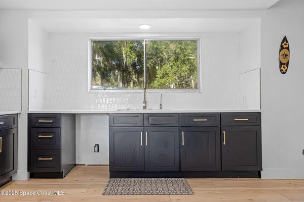 a kitchen with a sink and cabinets