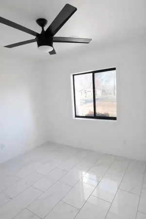 a view of an empty room with a window