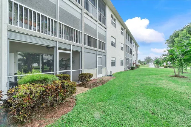 front view of a building with a yard