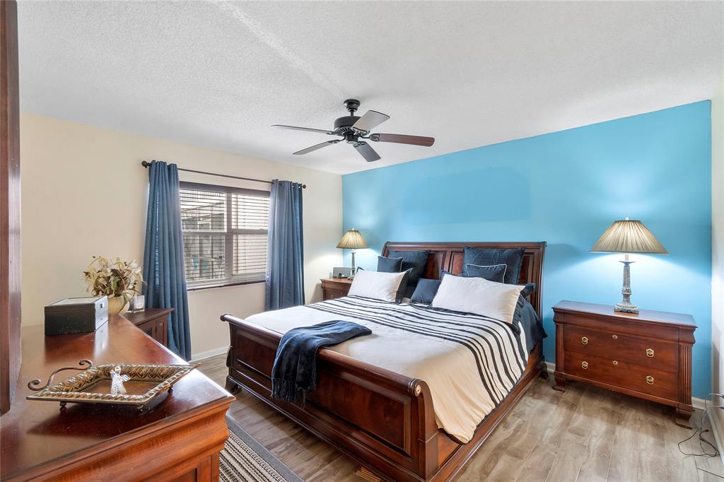 9856 Marina Boulevard, Unit 1311 Boca Raton, FL 33428 - Photo 8 of 26 a bedroom with a bed and a window