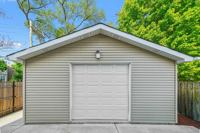 a small white house with a white roof and door