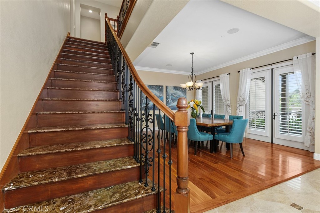 13337 Hunt Club Drive Rancho Cucamonga, CA 91739 - Photo 17 of 45 Staircase with wrought iron stair railing