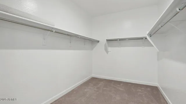 an empty room with closet area