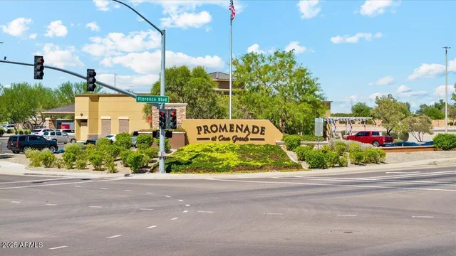 a city view with lot of flower plants in front of main door