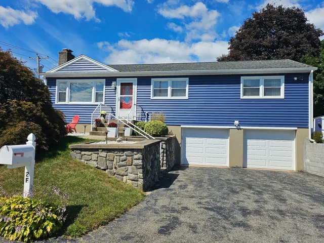 a front view of house with yard outdoor seating and barbeque oven
