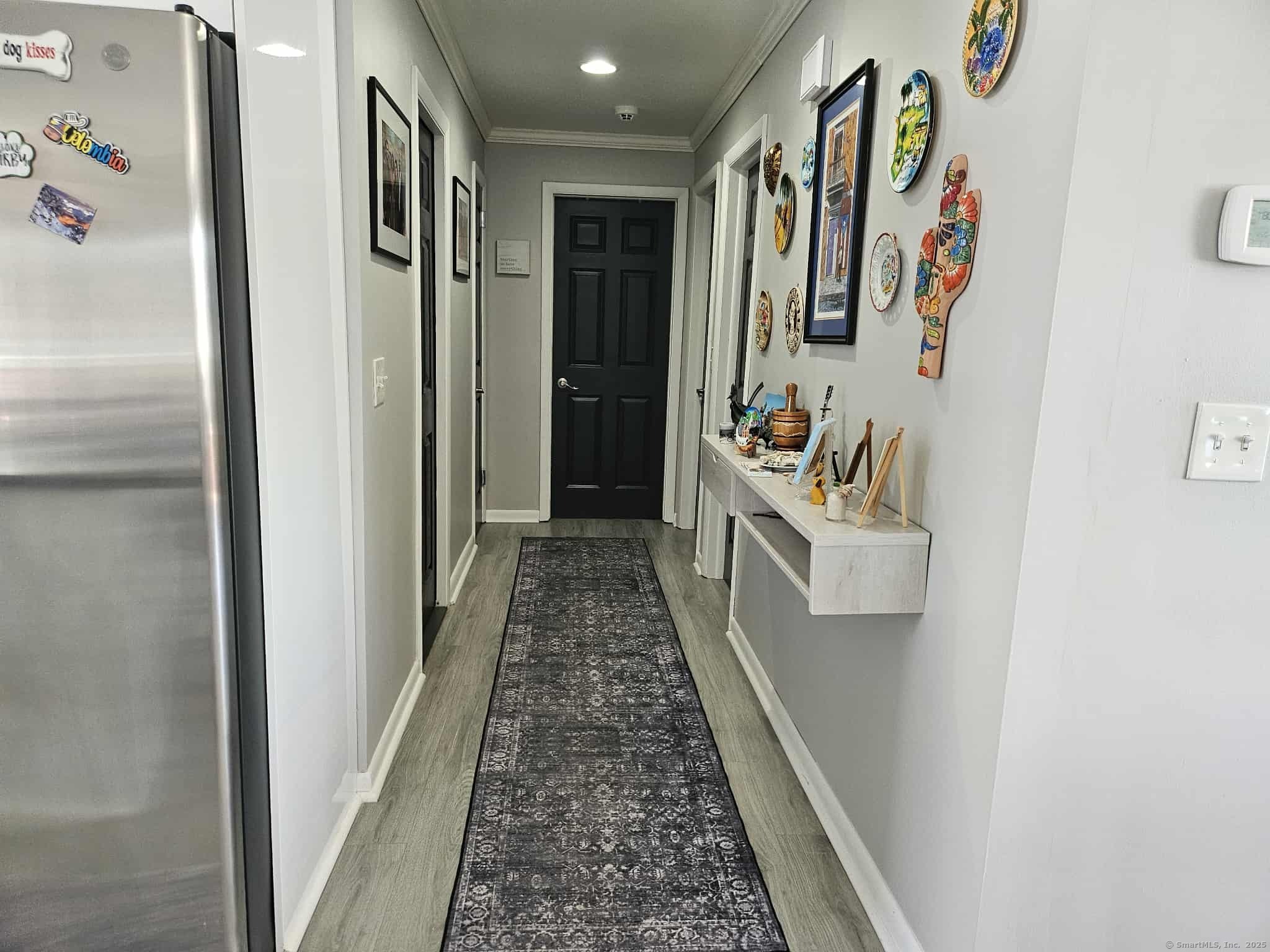 2 F Street Derby, CT 06418 - Photo 11 of 28 a hallway with painting on the wall