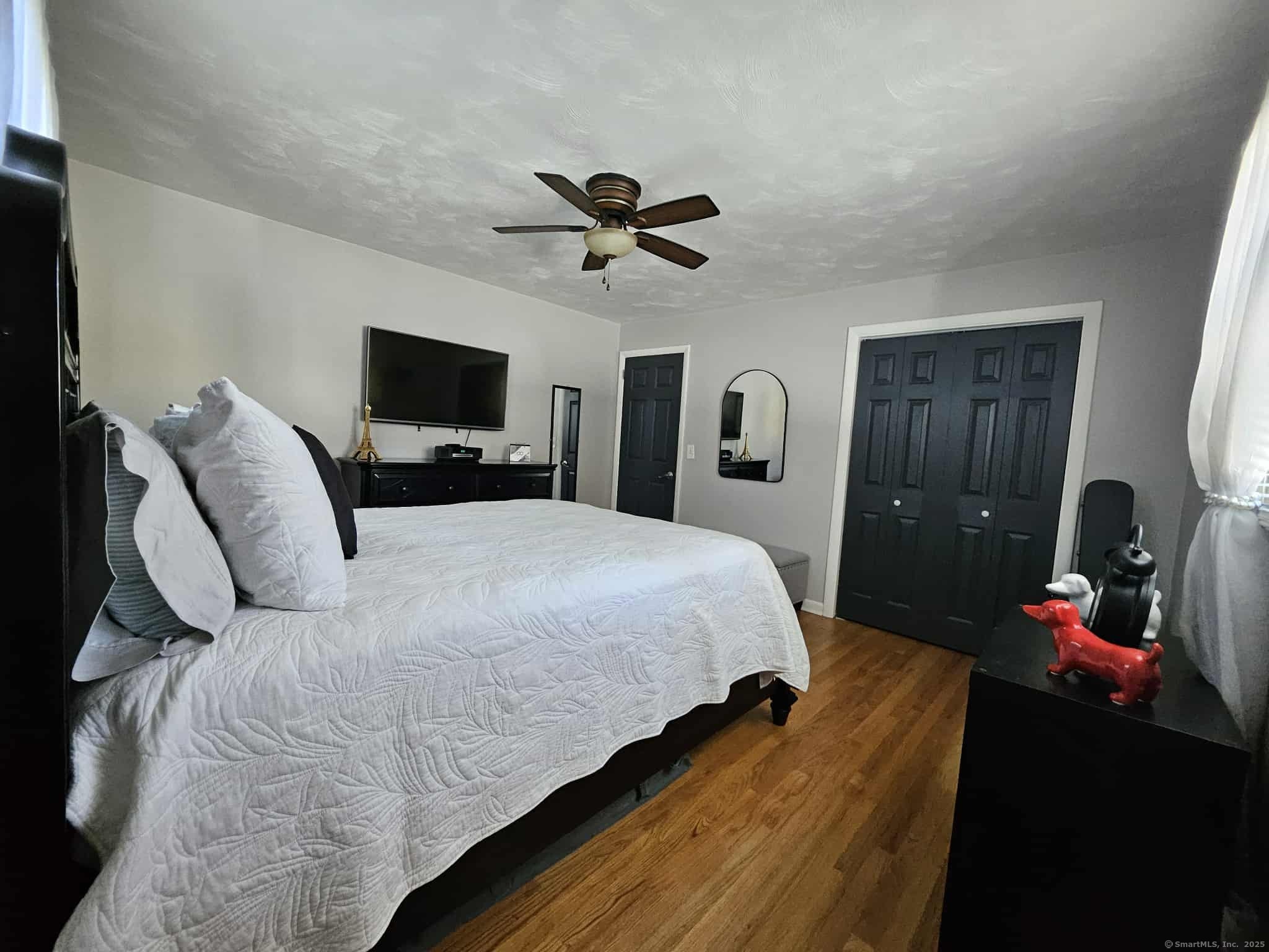 2 F Street Derby, CT 06418 - Photo 12 of 28 a bedroom with a bed and a flat screen tv