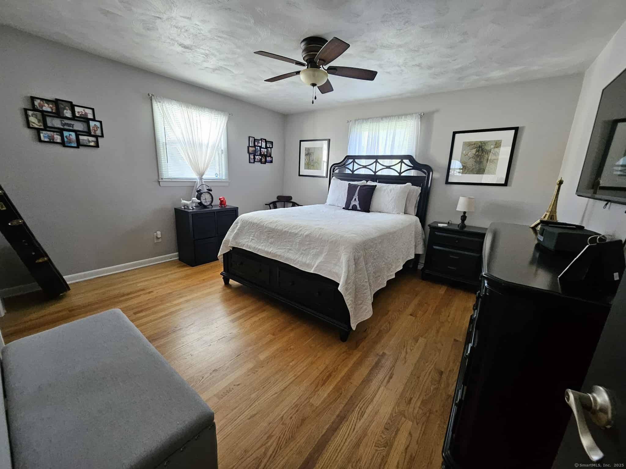 2 F Street Derby, CT 06418 - Photo 13 of 28 a spacious bedroom with a bed and wooden floor