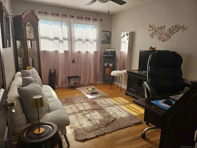 a living room with furniture and a window
