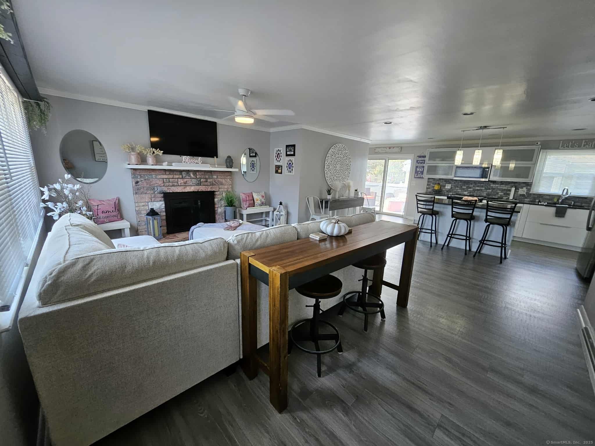 2 F Street Derby, CT 06418 - Photo 2 of 28 a living room with furniture a fireplace and a flat screen tv