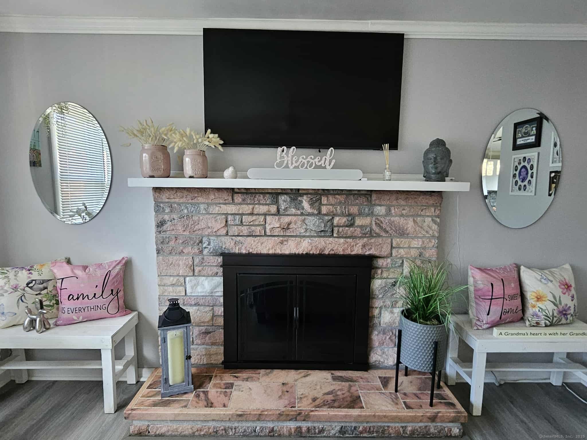 2 F Street Derby, CT 06418 - Photo 3 of 28 a living room with a fireplace and a flat screen tv