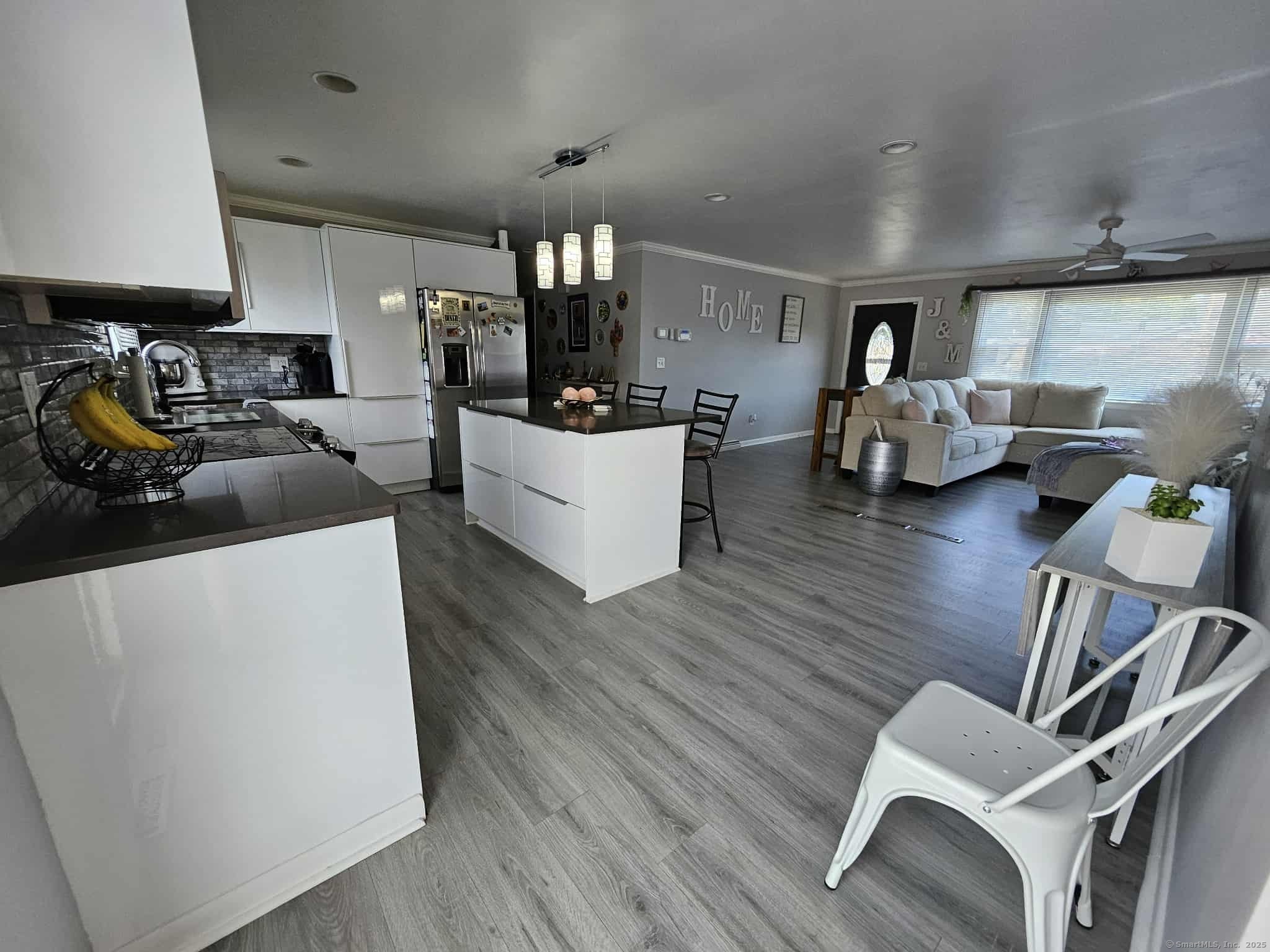 2 F Street Derby, CT 06418 - Photo 6 of 28 a living room with furniture and kitchen view