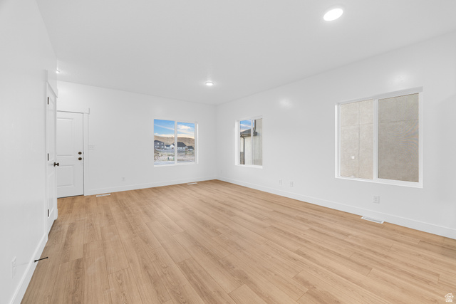 1563 South Deerbrook Road, Unit 267CHM Santaquin, UT 84655 - Photo 7 of 13 Spacious room featuring wood-finish flooring, white walls, and recessed lighting