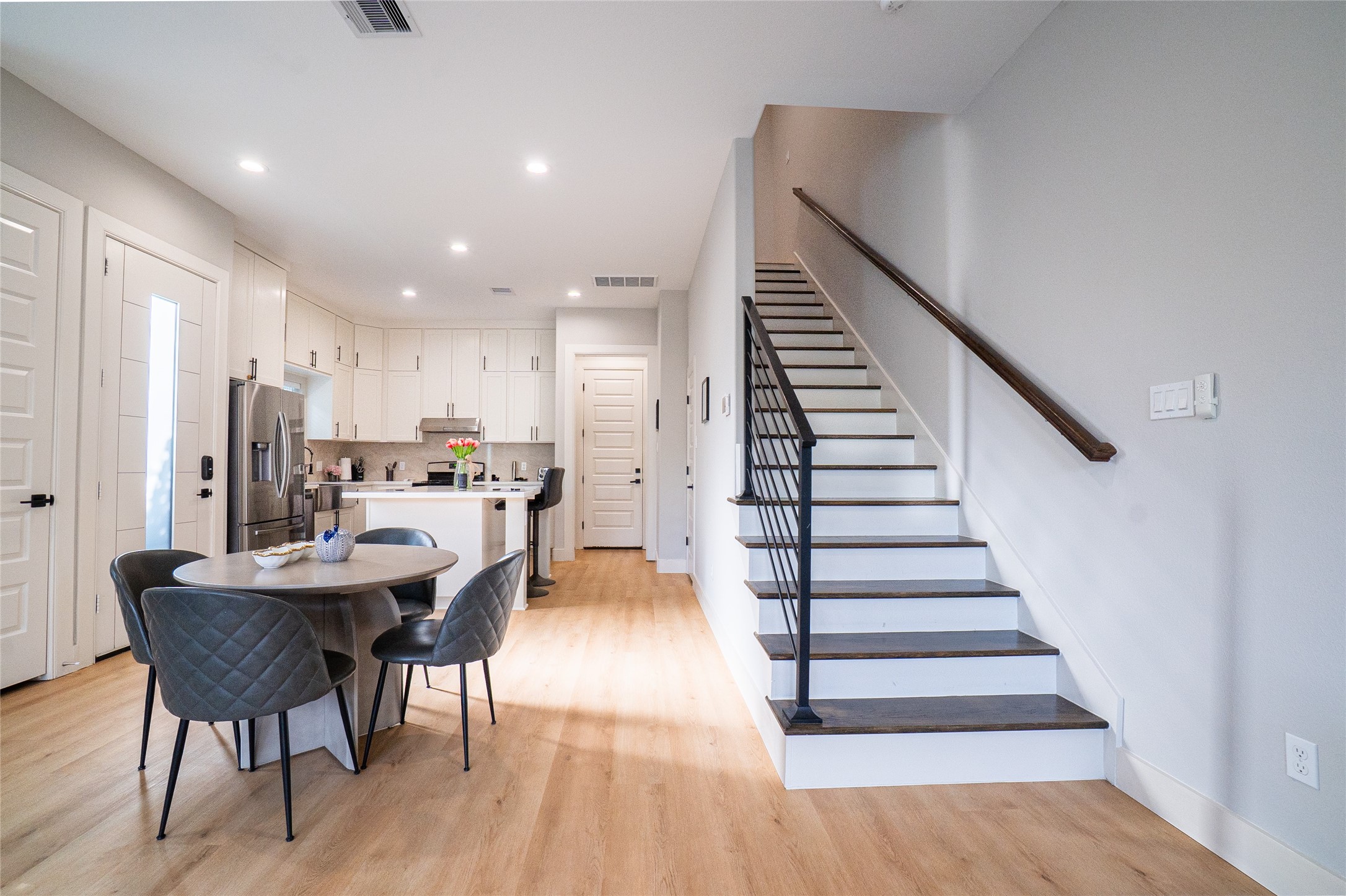 4607 Nolda Street, Unit B Houston, TX 77007 - Photo 4 of 14 Open concept with wooden stairs, brand new flooring throughout, and plenty of natural light.