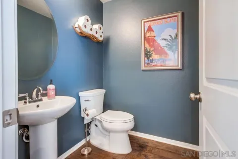a living room with furniture kitchen view and a large window