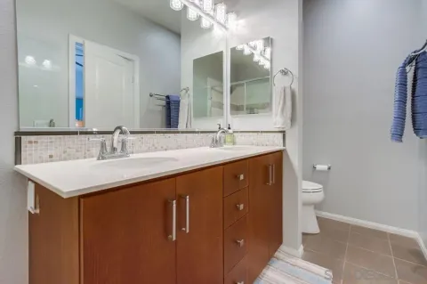 a view of a house with large windows and a table