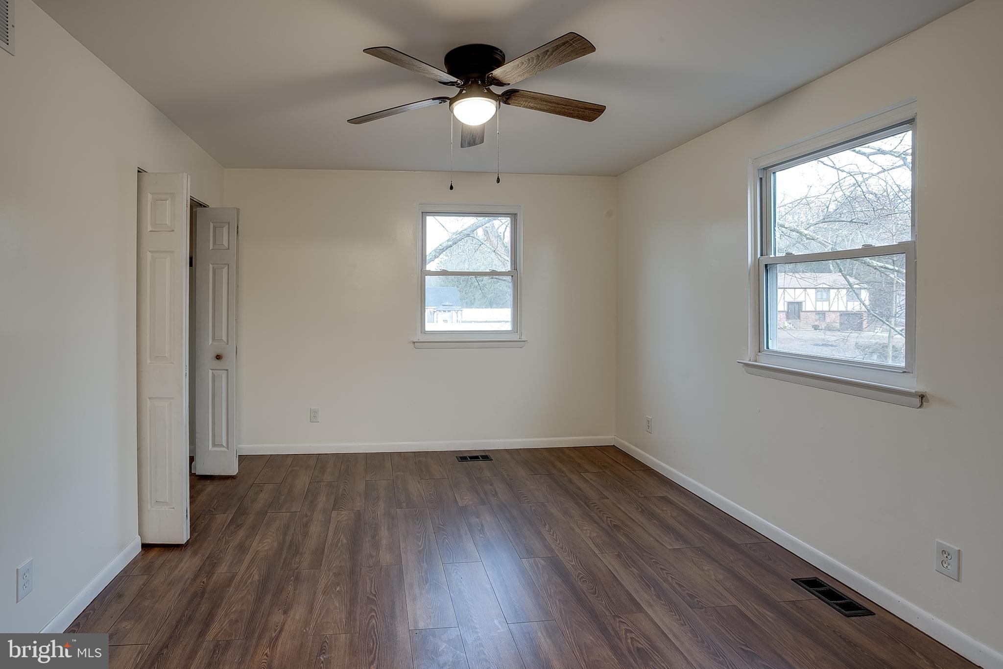 2430 Hopewell Road Berlin, NJ 08009 - Photo 11 of 30 a view of empty room with wooden floor and fan