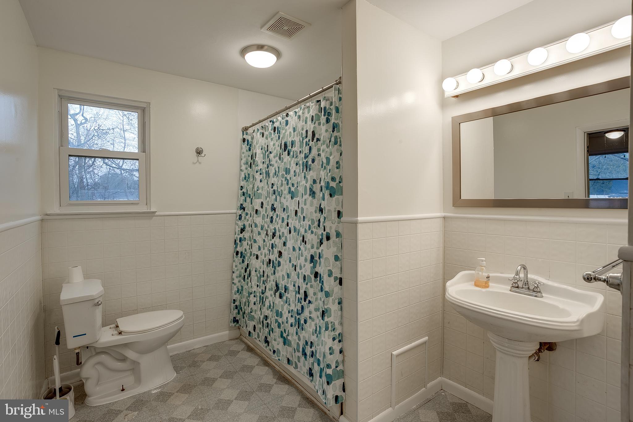2430 Hopewell Road Berlin, NJ 08009 - Photo 13 of 30 a bathroom with a sink toilet and shower