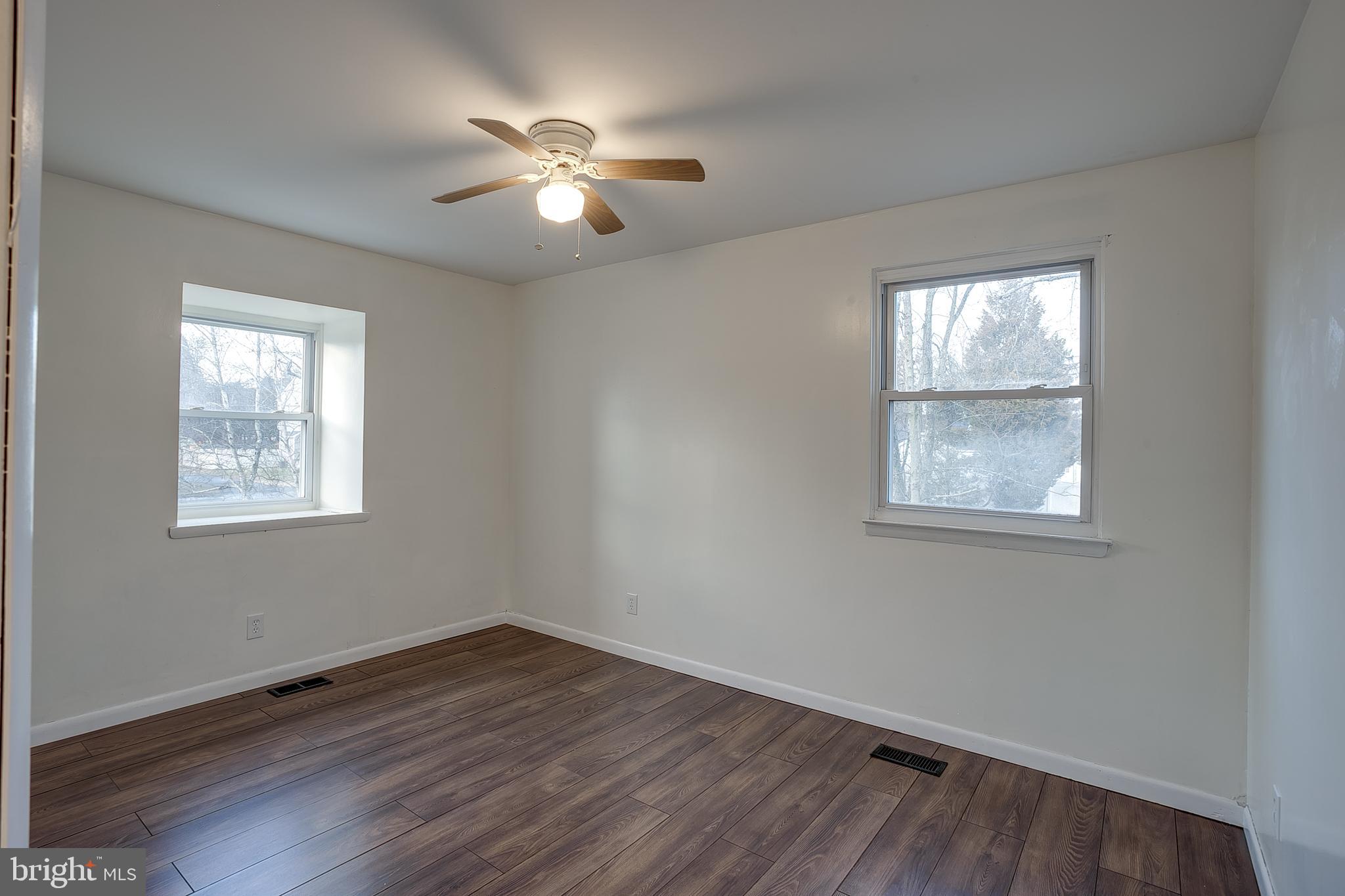 2430 Hopewell Road Berlin, NJ 08009 - Photo 14 of 30 wooden floor in an empty room with a window